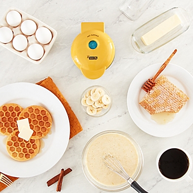 Dash&reg; Honeycomb Mini Waffle Maker in Yellow. View a larger version of this product image.