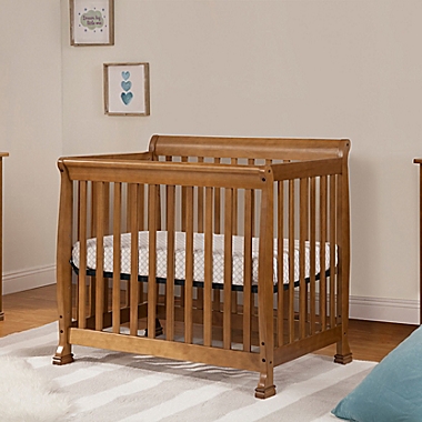 DaVinci Kalani 4-in-1 Convertible Mini Crib in Chestnut. View a larger version of this product image.