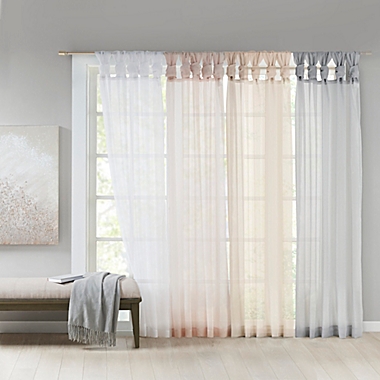 Madison Park Ceres 63-Inch Twist Tab Voile Window Curtain Panel in White (Single). View a larger version of this product image.