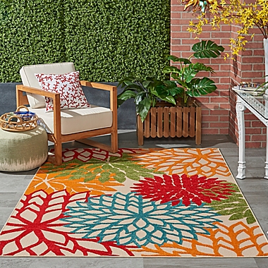 Nourison&trade; Aloha Floral Burst 5&#39;3&quot; x 7&#39;5&quot; Indoor/Outdoor Area Rug in Green. View a larger version of this product image.
