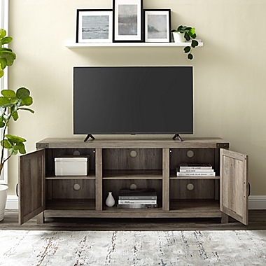 Forest Gate&trade; Wheatland 58-Inch Barn Door TV Stand in Grey. View a larger version of this product image.