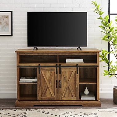 Forest Gate Wheatland 52-Inch Farmhouse Sliding Door TV Stand in Rustic Oak. View a larger version of this product image.