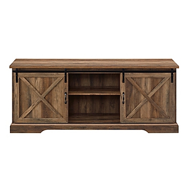 Forest Gate Wheatland 70-Inch Farmhouse Sliding Barn Door TV Stand in Rustic Oak. View a larger version of this product image.