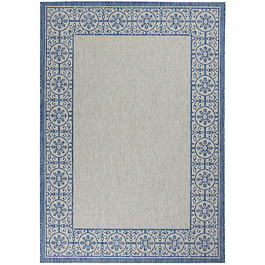 Alternate image 1 for Nourison Garden Party 7' x 10' Floral Bordered Indoor/Outdoor Area Rug in Ivory/Blue