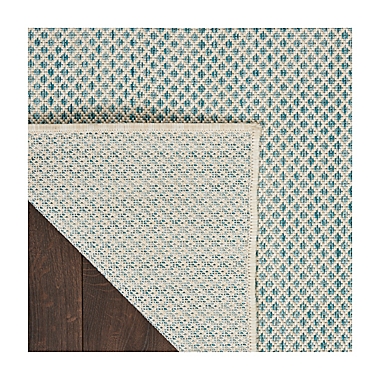 Nourison Courtyard 5&#39; x 7&#39; Indoor/Outdoor Area Rug in Ivory/Aqua. View a larger version of this product image.