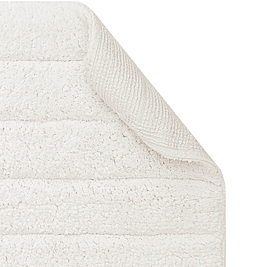 Haven&trade; 21&quot; x 34&quot; Organic Cotton Tufted Stripe Bath Rug in Coconut Milk. View a larger version of this product image.