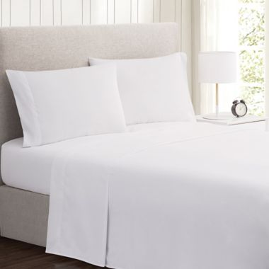 Simply Essential&trade; Truly Soft&trade; Microfiber Queen Solid Sheet Set in White. View a larger version of this product image.