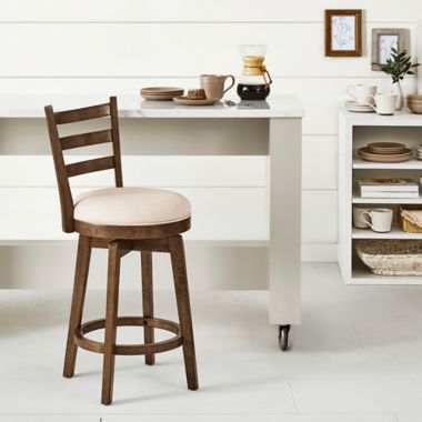 Bee &amp; Willow&trade; Ladder Back Swivel Counter Stool in Walnut. View a larger version of this product image.