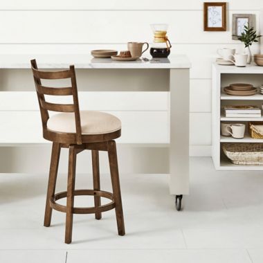 Bee &amp; Willow&trade; Ladder Back Swivel Counter Stool in Walnut. View a larger version of this product image.