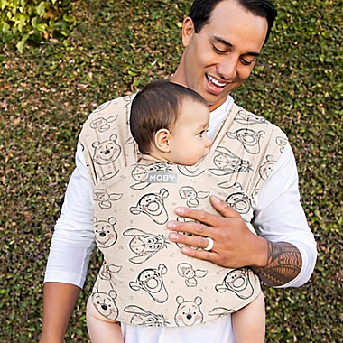 Moby Wrap&reg; Featherknit Winnie The Pooh &amp; Pals Baby Wrap Carrier in Cream. View a larger version of this product image.