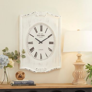 Ridge Road Décor 22-Inch x 31-Inch Farmhouse Wood Wall Clock in White. View a larger version of this product image.