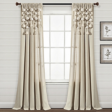 Lush D&eacute;cor Boho Pom-Pom Tassel 84-Inch Rod Pocket Window Curtain Panel in Linen (Single). View a larger version of this product image.