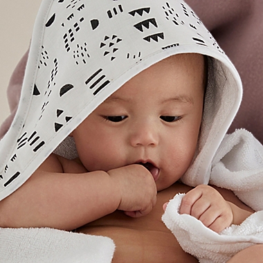 The Honest Company&reg; 3-Piece Pattern Play Hooded Towel and Washcloth Set in White/Black. View a larger version of this product image.
