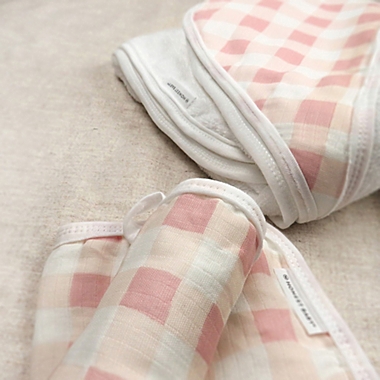 The Honest Company&reg; 3-Piece Peach Buffalo Check Hooded Towel and Washcloth Set. View a larger version of this product image.