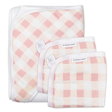 The Honest Company&reg; 3-Piece Peach Buffalo Check Hooded Towel and Washcloth Set. View a larger version of this product image.