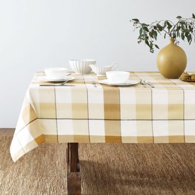 Bee &amp; Willow&trade; Tonal Check 60-Inch x 120-Inch Oblong Laminated Tablecloth in Yellow. View a larger version of this product image.
