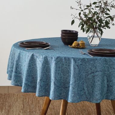 Bee &amp; Willow&trade; Etched 70-Inch Round Laminated Tablecloth in Chambray. View a larger version of this product image.