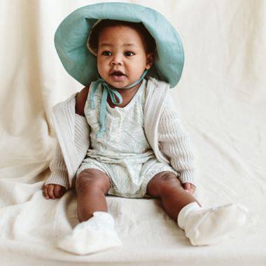 goumi Coastal Organic Cotton Romper in Green/Cream. View a larger version of this product image.