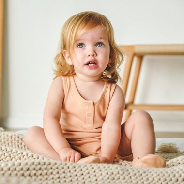 goumi Organic Cotton Romper in Poppy. View a larger version of this product image.