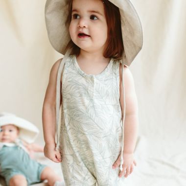 goumi Coastal Organic Cotton Romper in Green/Cream. View a larger version of this product image.