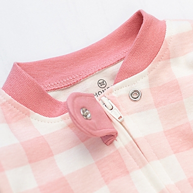 The Honest Company&reg; Size 24M  Buffalo Check Organic Cotton Snug-Fit Footed Pajamas in Pink Blush. View a larger version of this product image.