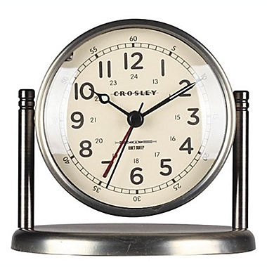 Crosley&reg; Pedestal Quiet Sweep Alarm Clock in Brass. View a larger version of this product image.