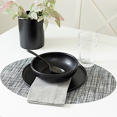 Studio 3B&trade; French Oval Woven Vinyl Placemats in Black (Set of 4). View a larger version of this product image.