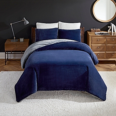 UGG&reg; Coco Dawson 2-Piece Reversible Twin Comforter Set in Navy. View a larger version of this product image.