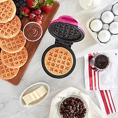 Dash&reg; Love Mini Waffle Maker in Magenta. View a larger version of this product image.