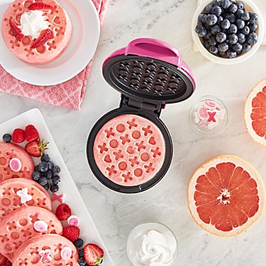 Dash&reg; Love Mini Waffle Maker in Magenta. View a larger version of this product image.