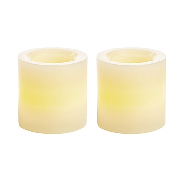Simply Essential&trade; 2-Pack Mini Wax LED Pillar Candles in Cream. View a larger version of this product image.