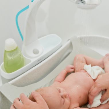 The First Years&reg; Rain Shower and Baby Spa Tub. View a larger version of this product image.