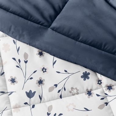Home Collection&reg; Forget Me Not 3-Piece Reversible Full/Queen Comforter Set in Navy. View a larger version of this product image.