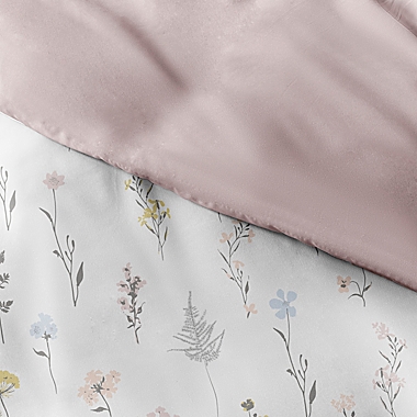 Home Collection&reg; Wild Flower 2-Piece Reversible Twin/Twin XL Duvet Cover Set in Pink. View a larger version of this product image.