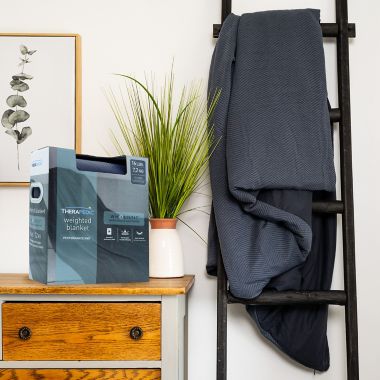 Therapedic&reg; 12 lb. Jersey Knit Weighted Blanket in Navy. View a larger version of this product image.