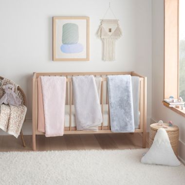 UGG&reg; Dawson Faux Fur Toddler Blanket in Peach. View a larger version of this product image.