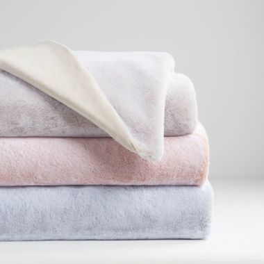 UGG&reg; Dawson Faux Fur Toddler Blanket in Peach. View a larger version of this product image.