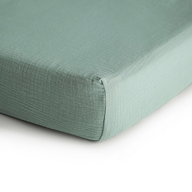 Mushie&reg; Muslin Fitted Crib Sheet in Green. View a larger version of this product image.