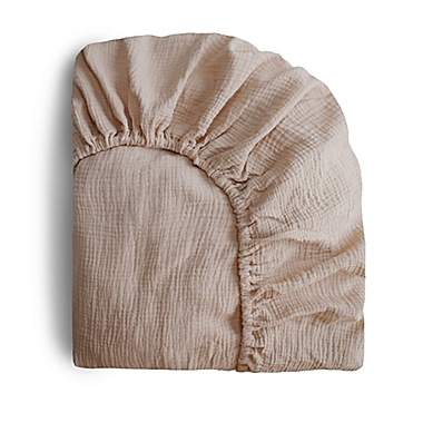 Mushie&reg; Muslin Fitted Crib Sheet in Natural. View a larger version of this product image.