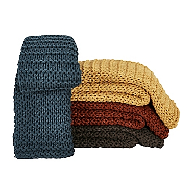 Oscar/Oliver Luca Throw Blanket in Tumeric. View a larger version of this product image.