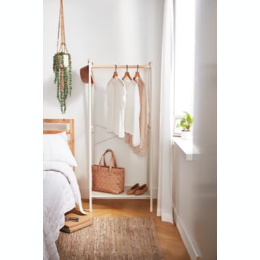 Squared Away&trade; Metal Garment Rack with Storage Base in Coconut Milk. View a larger version of this product image.