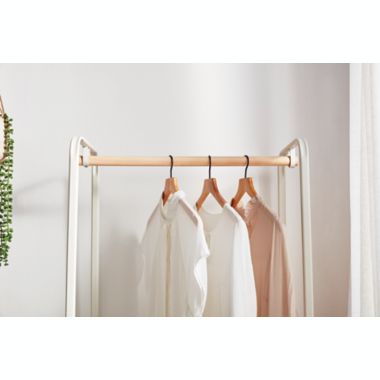 Squared Away&trade; Metal Garment Rack with Storage Base in Coconut Milk. View a larger version of this product image.