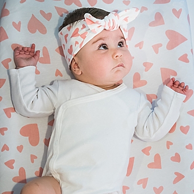 Norani&reg; Organic Cotton Fitted Crib Sheet in Pink Hearts. View a larger version of this product image.
