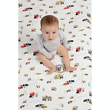Loulou Lollipop&reg; Happy Trucks Muslin Fitted Crib Sheet in White. View a larger version of this product image.