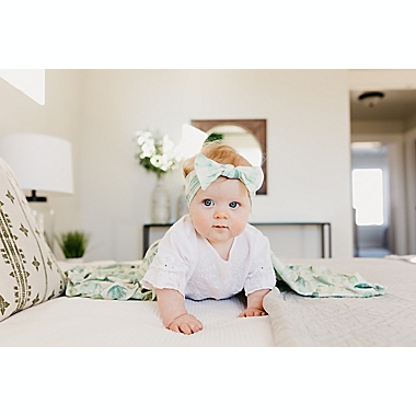 Copper Pearl&reg; Size 0-4M Desert Knit Bow Headband in Green. View a larger version of this product image.