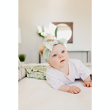 Copper Pearl&reg; Size 0-4M Desert Knit Bow Headband in Green. View a larger version of this product image.