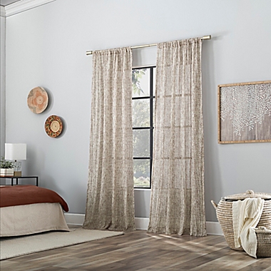 Scott Living Tulin Watercolor Print Sheer 84-Inch Rod Pocket Window Curtain Panel in Pecan Brown. View a larger version of this product image.