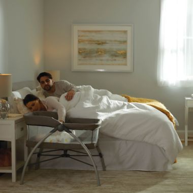 The First Years&trade; First Dreams Portable Bassinet Baby Sleeper in Grey. View a larger version of this product image.