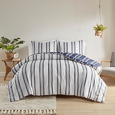 Clean Spaces Cobi 3-Piece Reversible Striped King/California King Comforter Set in Navy. View a larger version of this product image.