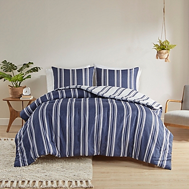 Clean Spaces Cobi 3-Piece Reversible Striped Full/Queen Comforter Set in Navy. View a larger version of this product image.